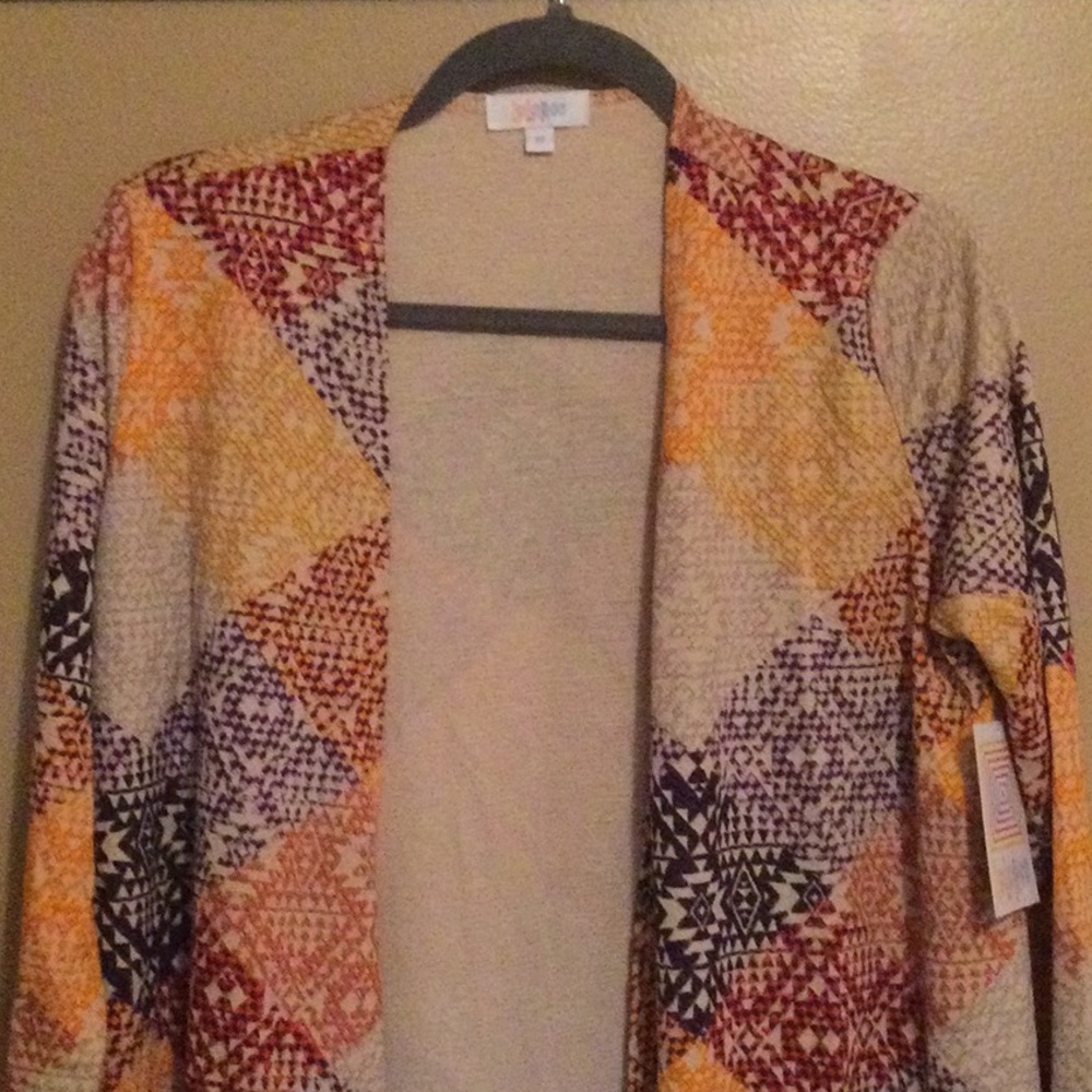 NWT Lularoe Sarah Sweater, size Medium. Geometric pattern with yellow, red